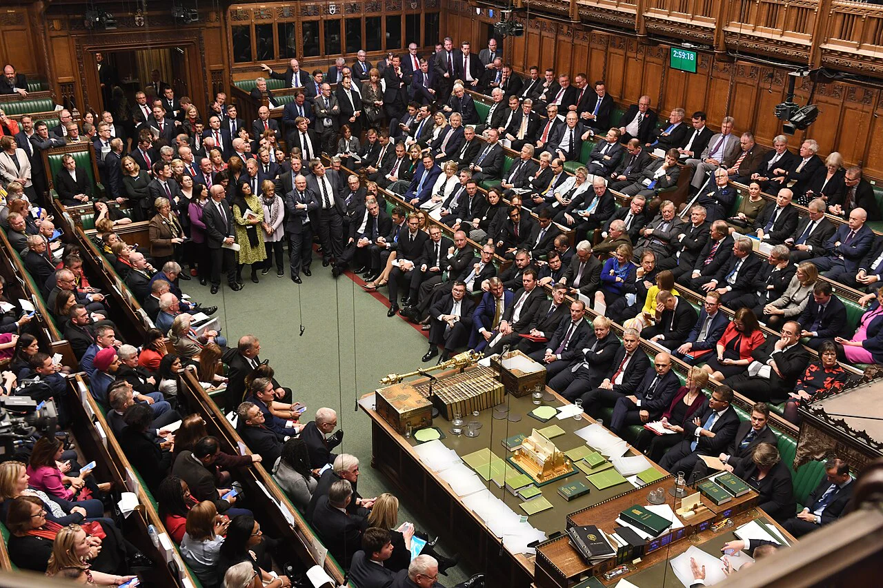 The UK House of Commons chamber filled with members of Parliament.